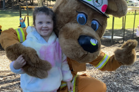 Abby with the Rural Fire Brigade mascot.