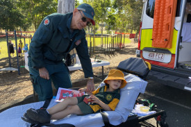 Kilcoy State School student Archer receives attention at the ambulance bed.