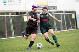 Caboolture’s Jill Kosseris (left) vies for possession alongside a Toowong opponent during the grand final. Kosseris was the competition’s leading goal scorer. Photo credit: atnc photography.