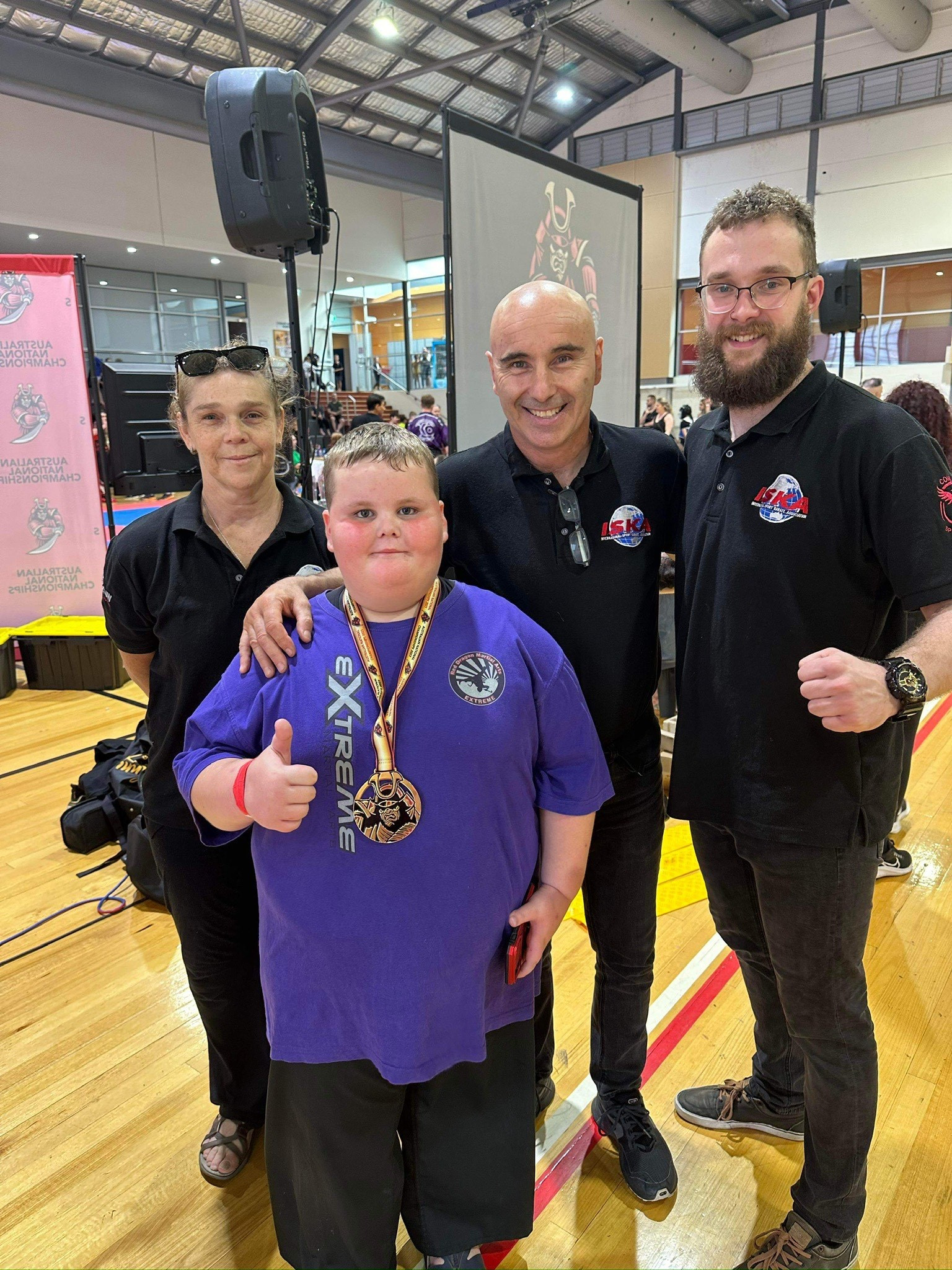 Michael Cox (front) was presented with a first placing in BJJ for 8-9 year olds, for showing great sportsmanship in stepping up to the 10-12 year division.