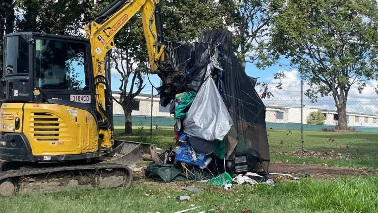 Excavator removing homeless tent from Eddie Hyland Park on April 9. Photo: Facebook/Nourish Street