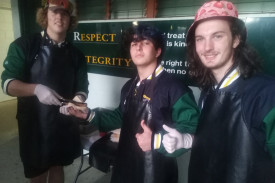 Nick, Jai and Dorian at the sausage sizzle, at the Lowood secondary school’s 40-year anniversary event.