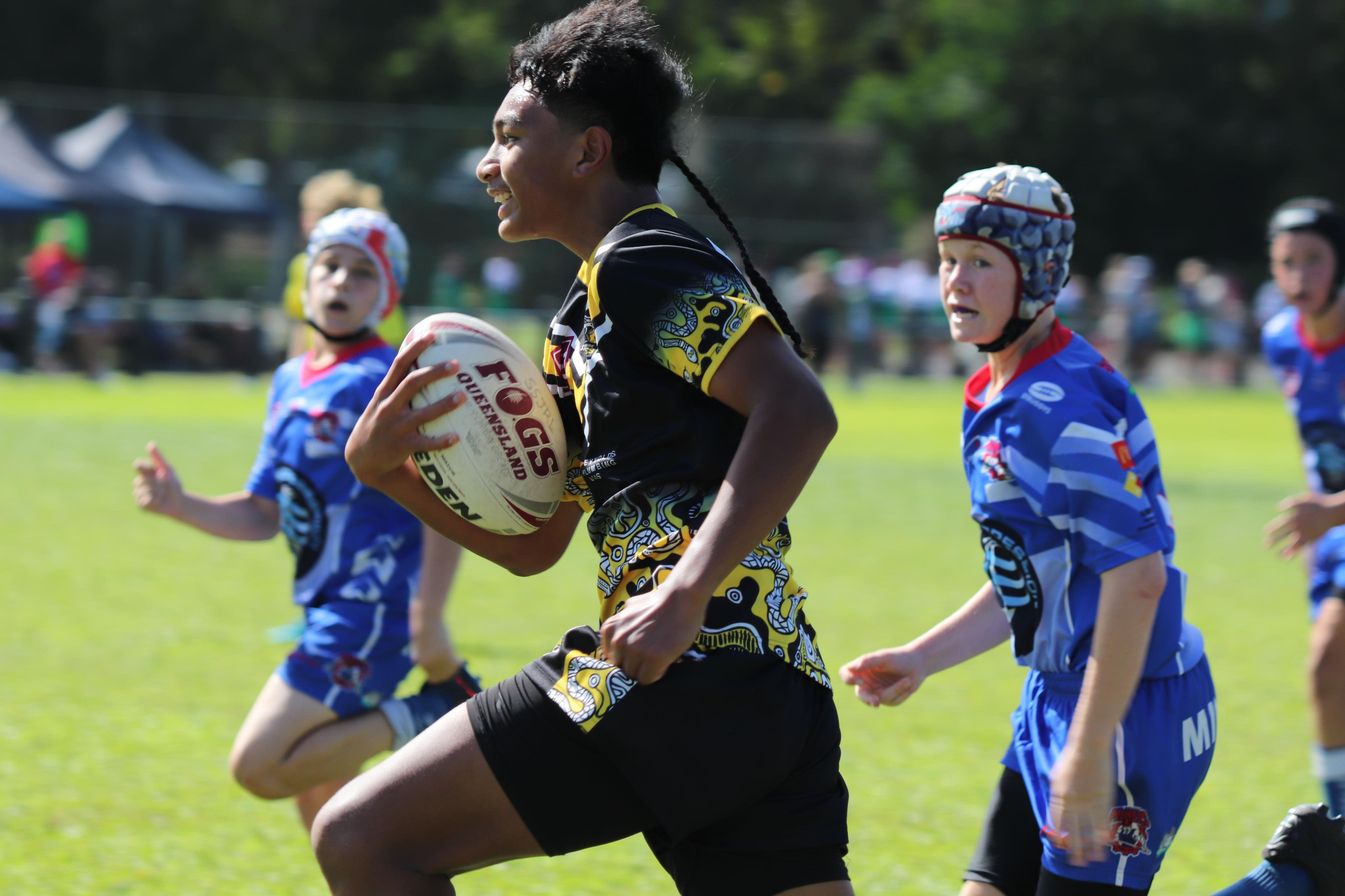 Iosefo Taateo runs with the ball for the Caboolture U13s in the Nate Myles Cup.
