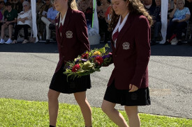 two-students-from-kilcoy-state-high-school-prepare-to-lay-a-wreath.jpeg