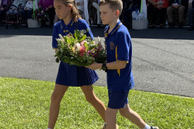 two-students-from-mt-kilcoy-state-school-prepare-to-lay-a-wreath.jpeg