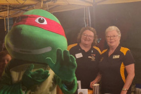 Lisa Gourley and Michelle Kalms with Raphael at the movie night in Wamuran.