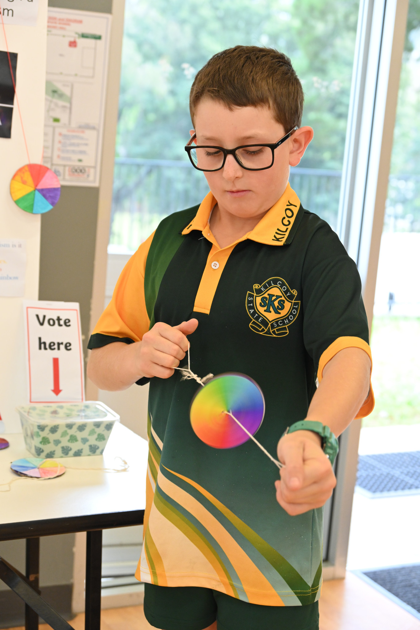 Student showing how Newton’s Disc works.