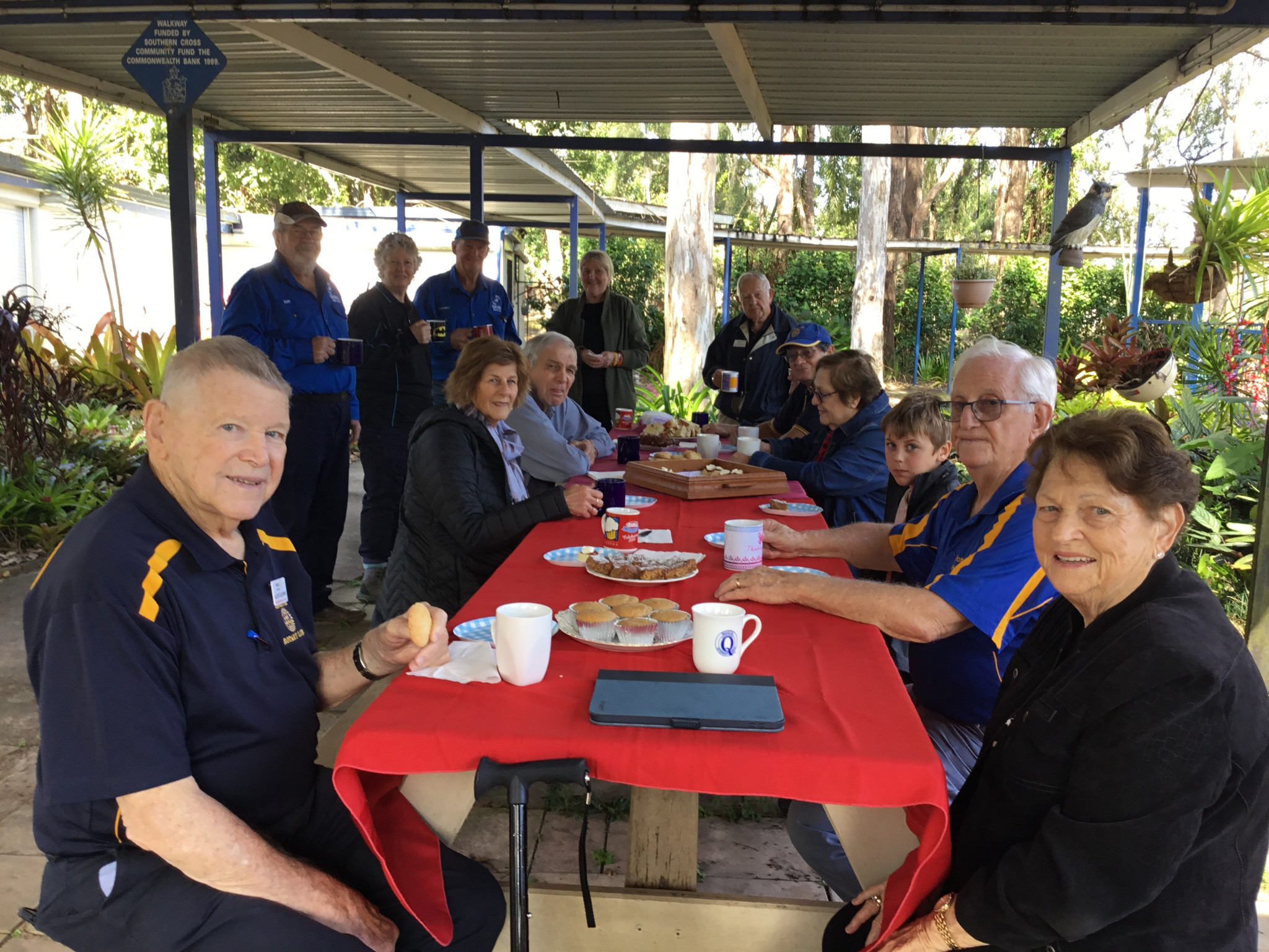Volunteers and Rotarians enjoying morning tea.