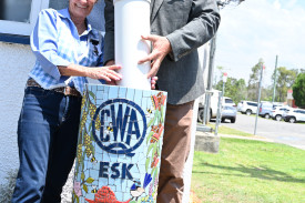 Esk QCWA Patti and Mayor Wendt burying the capsule.