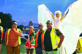 A Christmas elf and fairy with some of the behind-the-scenes man power that helps bring the magic together at the Kilcoy Christmas Carnival, from left, Gary Jeppesen, Kevin Weaver, Josh Woodrow and Paul Potts.