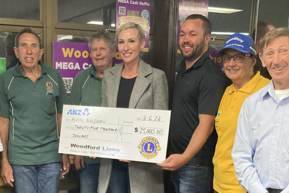 Ron Remfrey, David Kearns (Woodford Lions president), Alina Baisden (Mega Cash raffle winner), Tony Latter (Moreton Bay councillor), Angie Liggins and Andrew Clews.