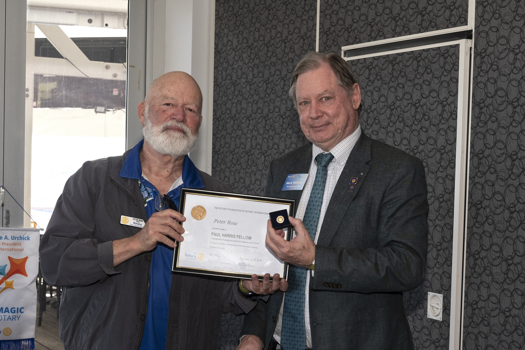 District 9620 Governor Mark Williams presenting ‘Paul Harris Fellow’ award to Rotarian Peter Row.