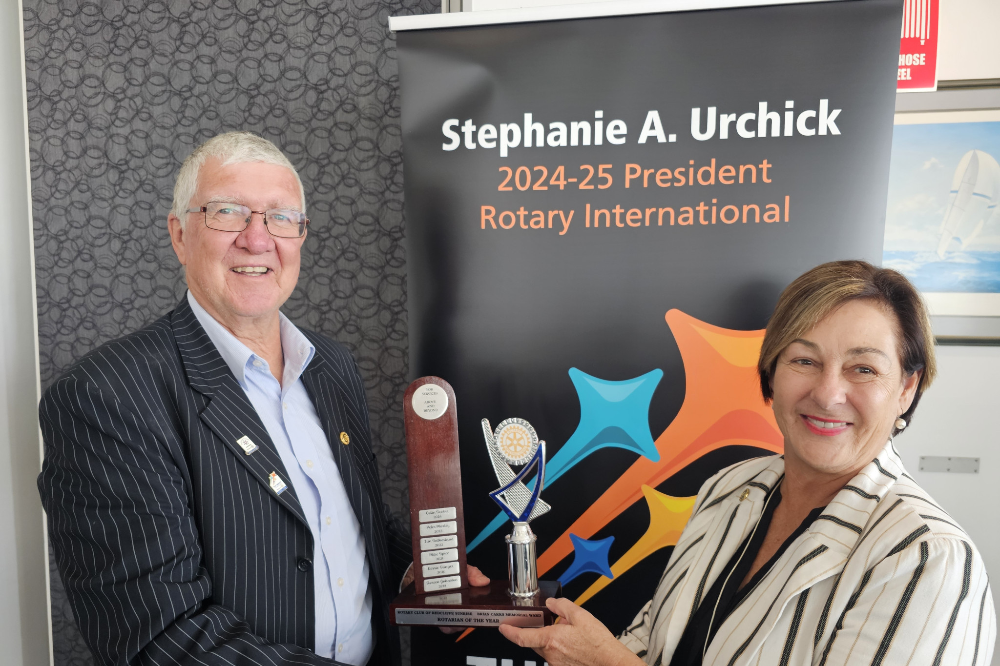 Colin Scobie receiving his Rotarian of the Year award from Cr Sandra Ruck.