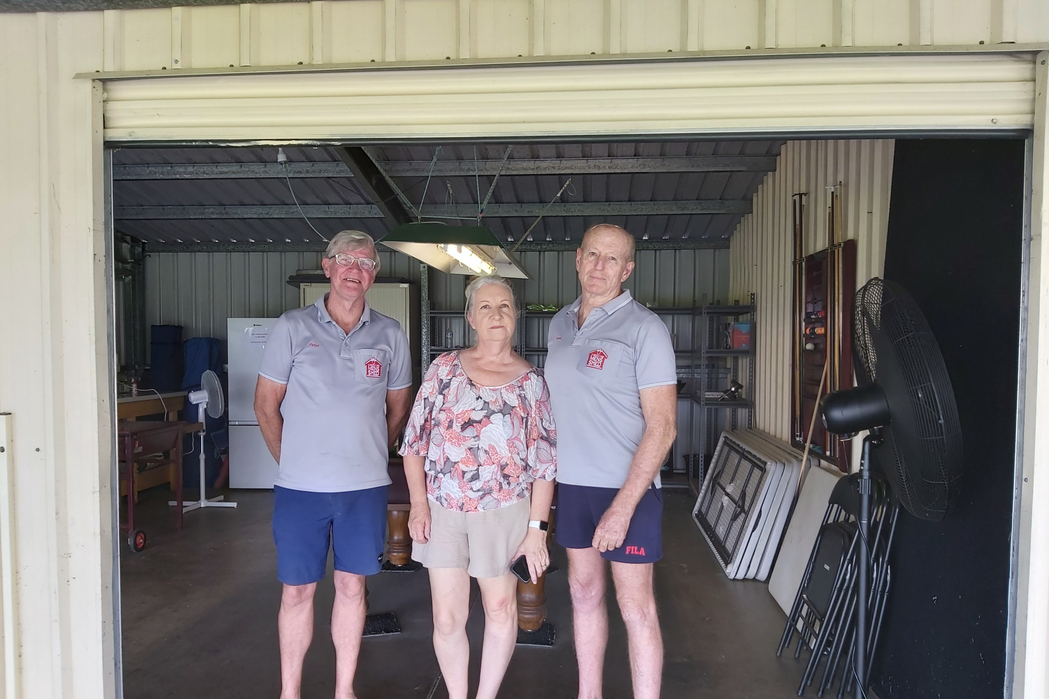 Caboolture Men’s Shed president Dennis (right), wife Ann, and long-time member Peter at break-in spot.