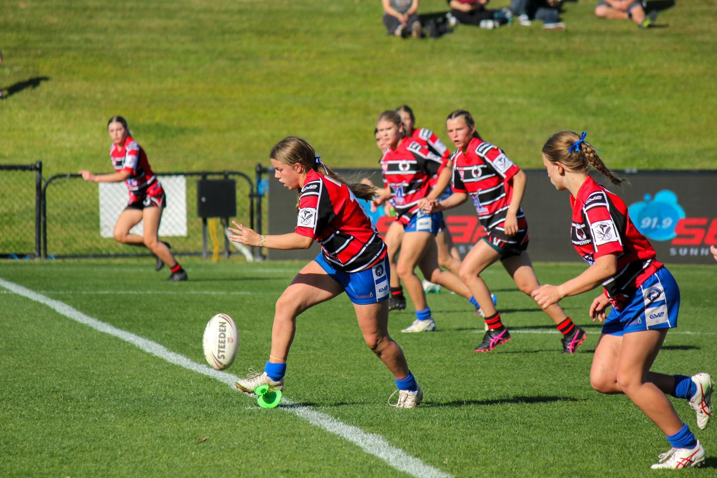 Stanley River Wolves girls players running in a pack.