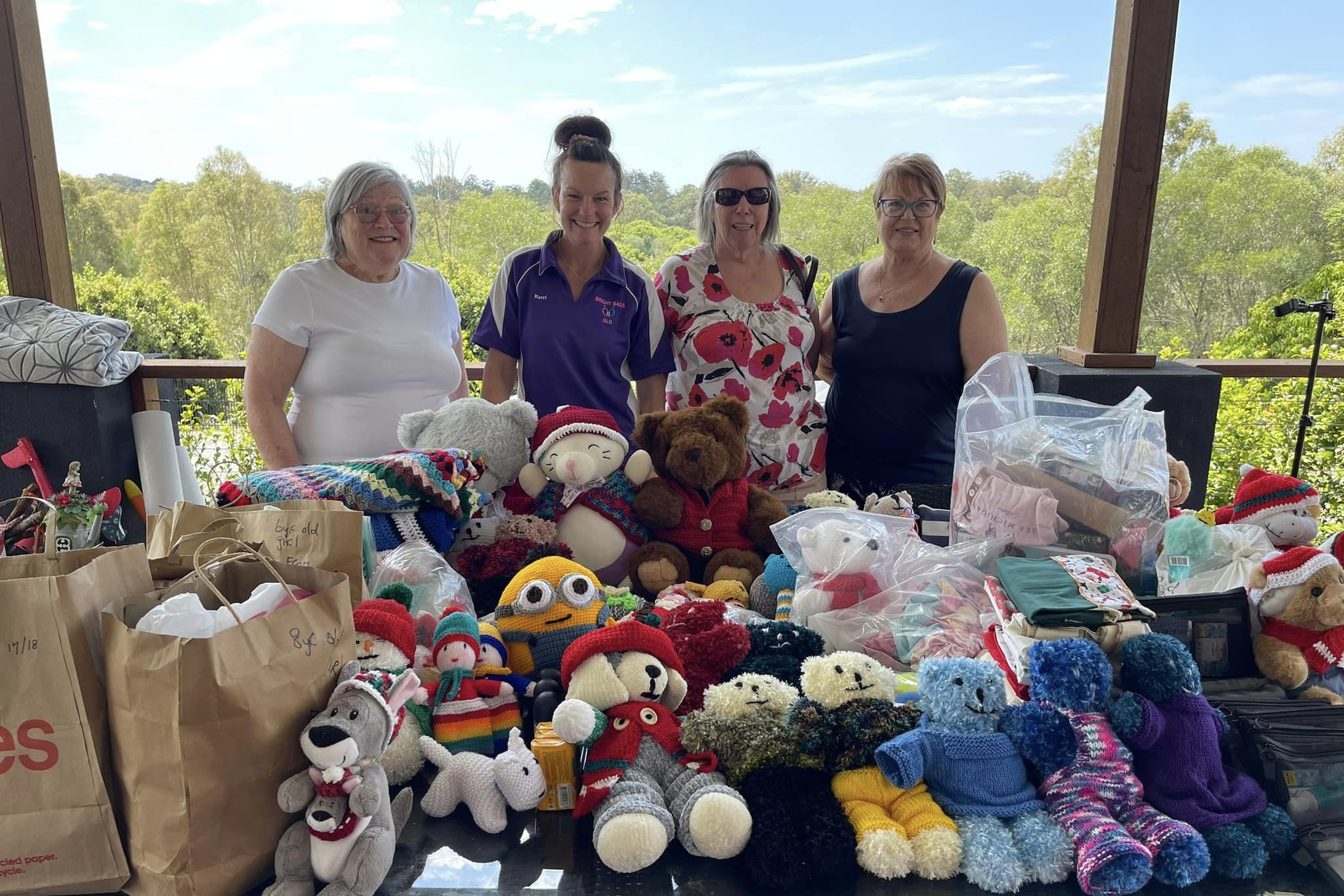 Knit, Crochet, Donate Strathpine members, Shelly Trish and Peggy, with Kerri Raedel and donated gifts.