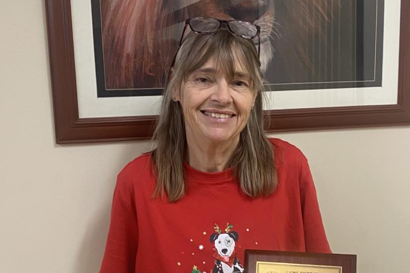 Cheryl Hegemann with her award plaques.