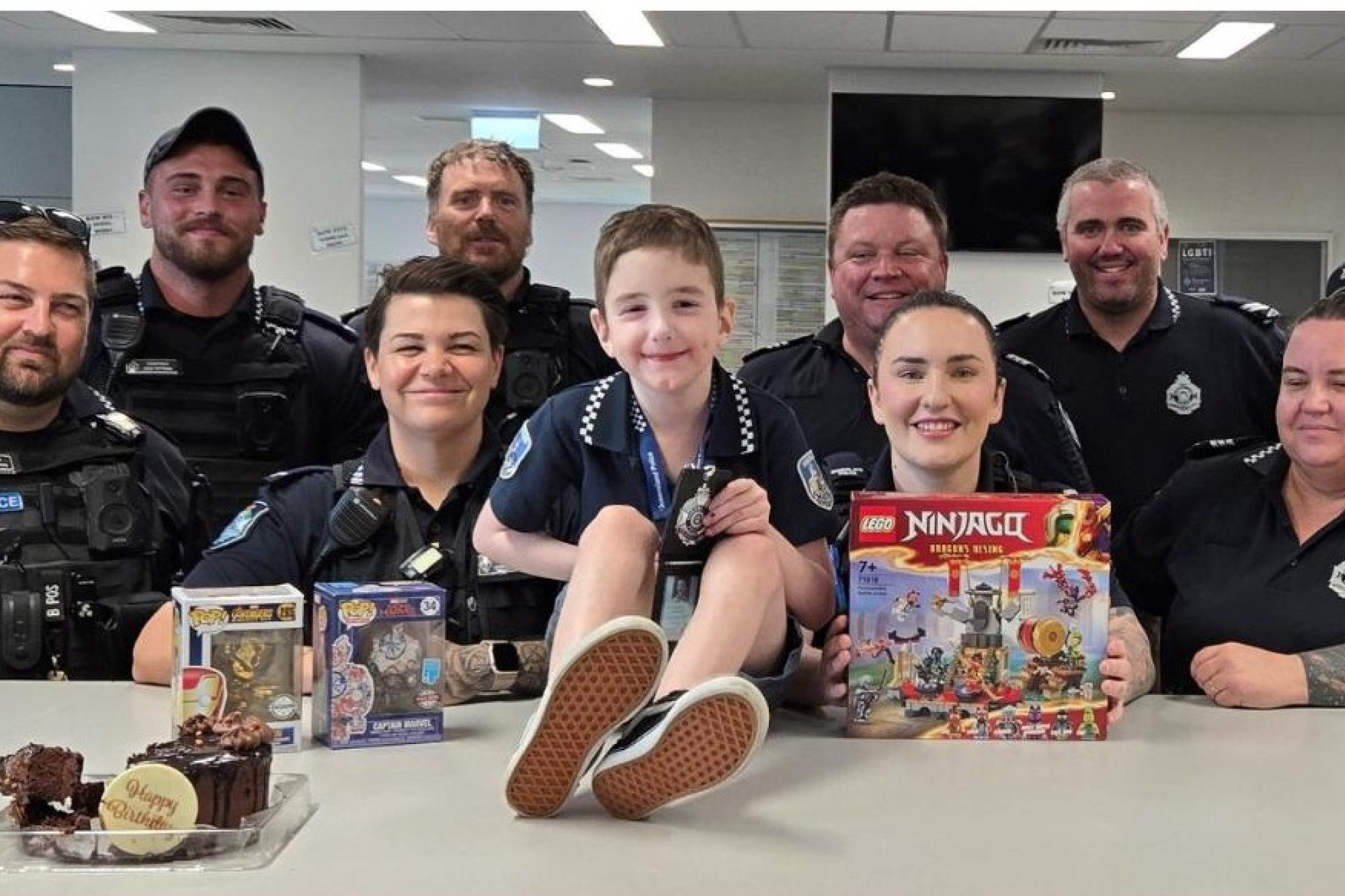 Hamish celebrating his 8th birthday with Caboolture QPS colleagues. Photo: myPolice Moreton/ Facebook.