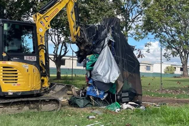 Excavator removing homeless tent from Eddie Hyland Park on April 9. Photo: Facebook/Nourish Street.