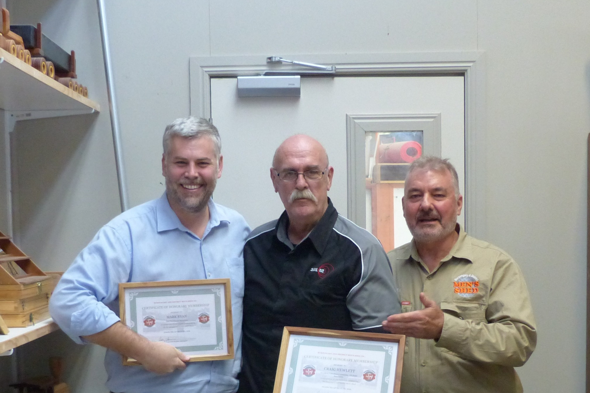 President Rodney Hanson presenting Honorary Membership to Member for Morayfi eld Mark Ryan, 101.5FM manager, Craig Hewlett. Photo: Mark Ryan.