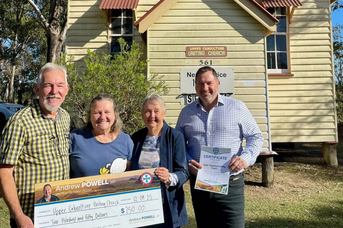 Church members receiving cheque from Andrew Powell MP. Photo: Facebook.