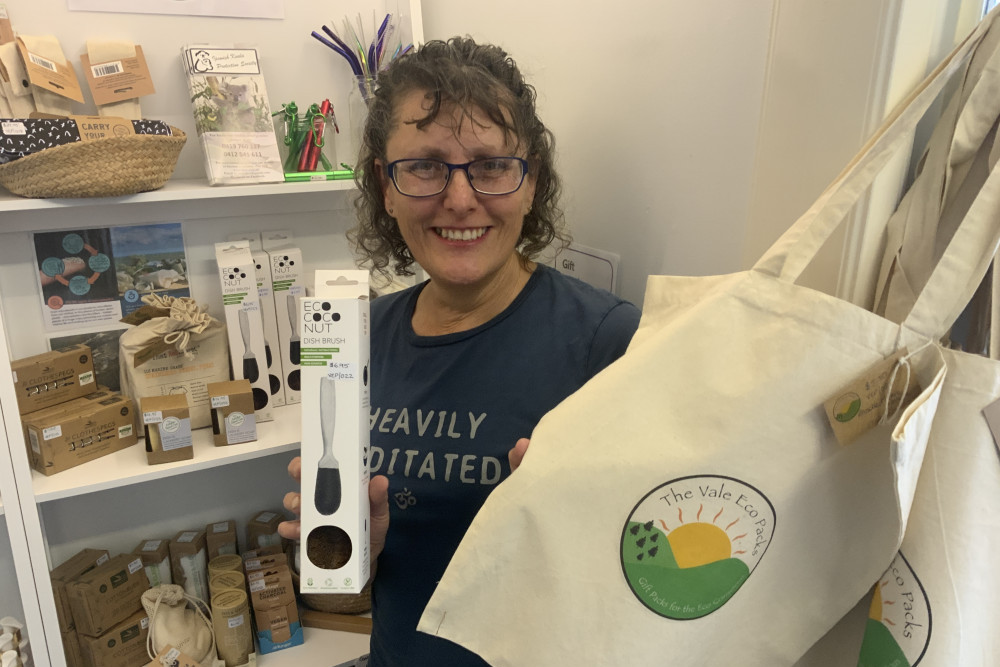 Pictured with a compostable dish brush and reusable shopping bags, Glamorgan Vale resident Lynne Howard fully supports the State Government’s recently introduced ban on single-use plastic items.