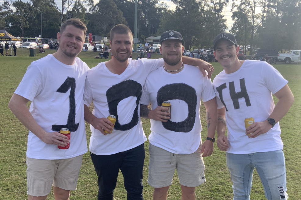 John Flew’s mates dress to impress as they acknowledge his 100th appearance for the Caboolture Snakes.
