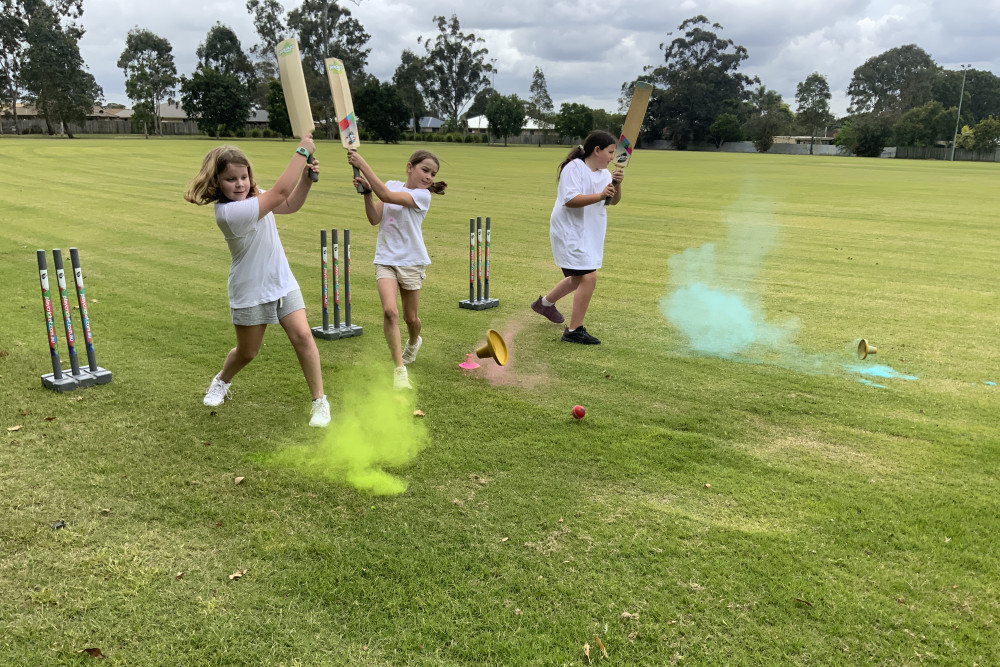 Kaylie, Emily and Kaylee hit the ball off launch tees at Caboolture, during the That’s My Game Colour Blast program.