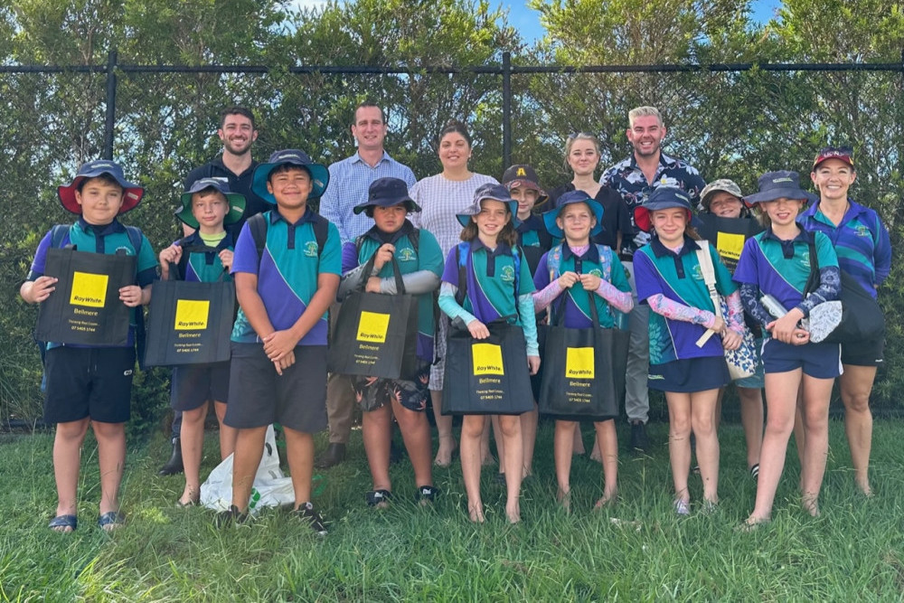 Students from Bellmere State School (front) with staff from Ray White Wamuran | Bellmere (back).