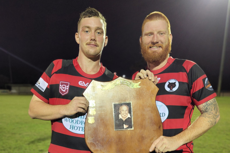 Stanley River Wolves captains James Cochran and Sam ‘Carrot’ Armitage with the Doug Drew Shield after the win at Bribie Island.
