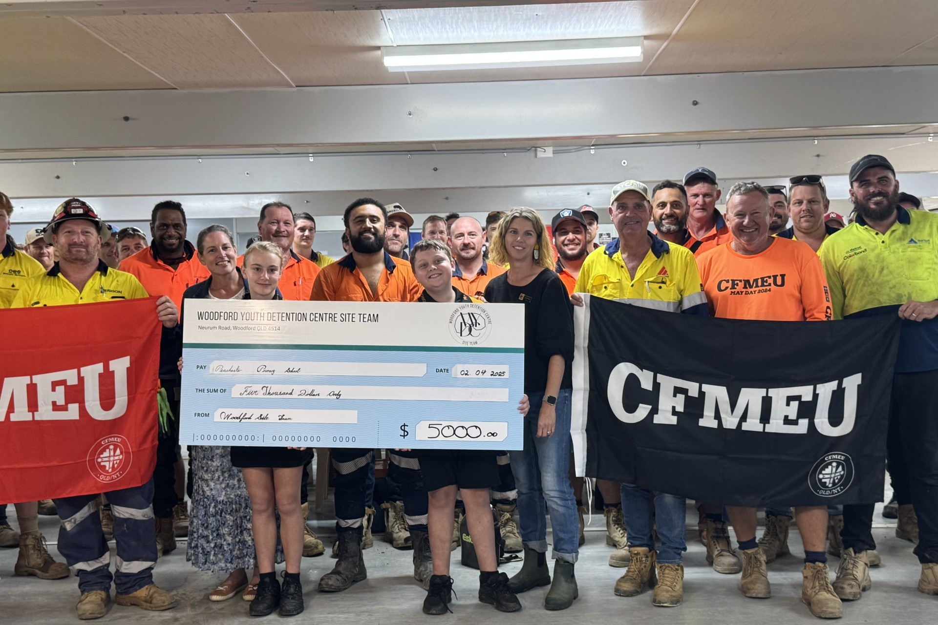 Bill Johnson and construction site team presenting a donation to Peachester SS Student leaders.