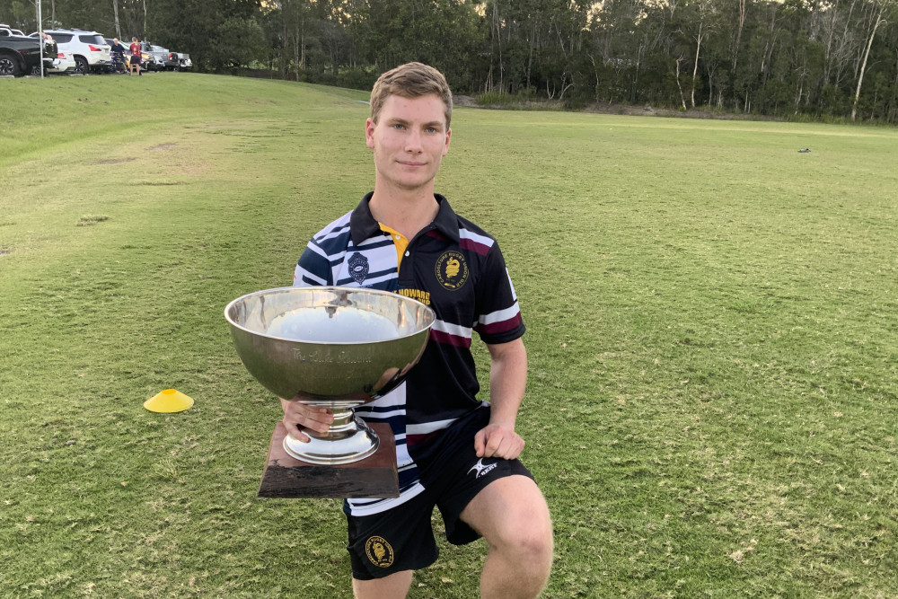 Sam Hoffman with the Luke Howard Memorial Cup, to be contested between the Caboolture Snakes and Brothers Rockhampton in a rugby union trial on Saturday.