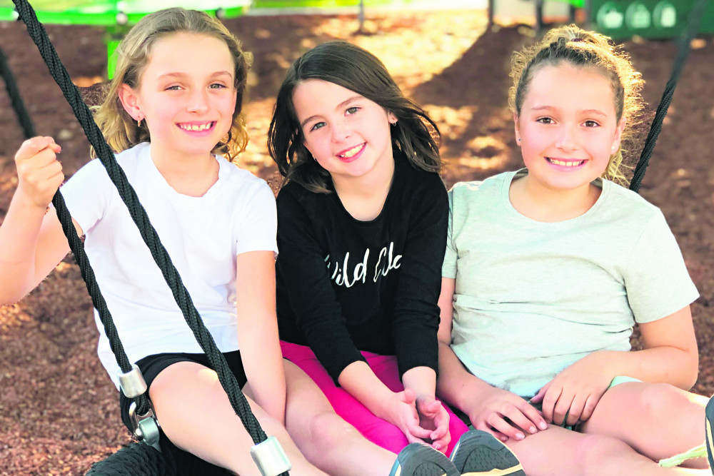 Maggie Isidro, Grace Wheeler and Maddison Isidro enjoy playing at Children’s Park in Toogoolawah which has recently been upgraded by Somerset Regional Council.