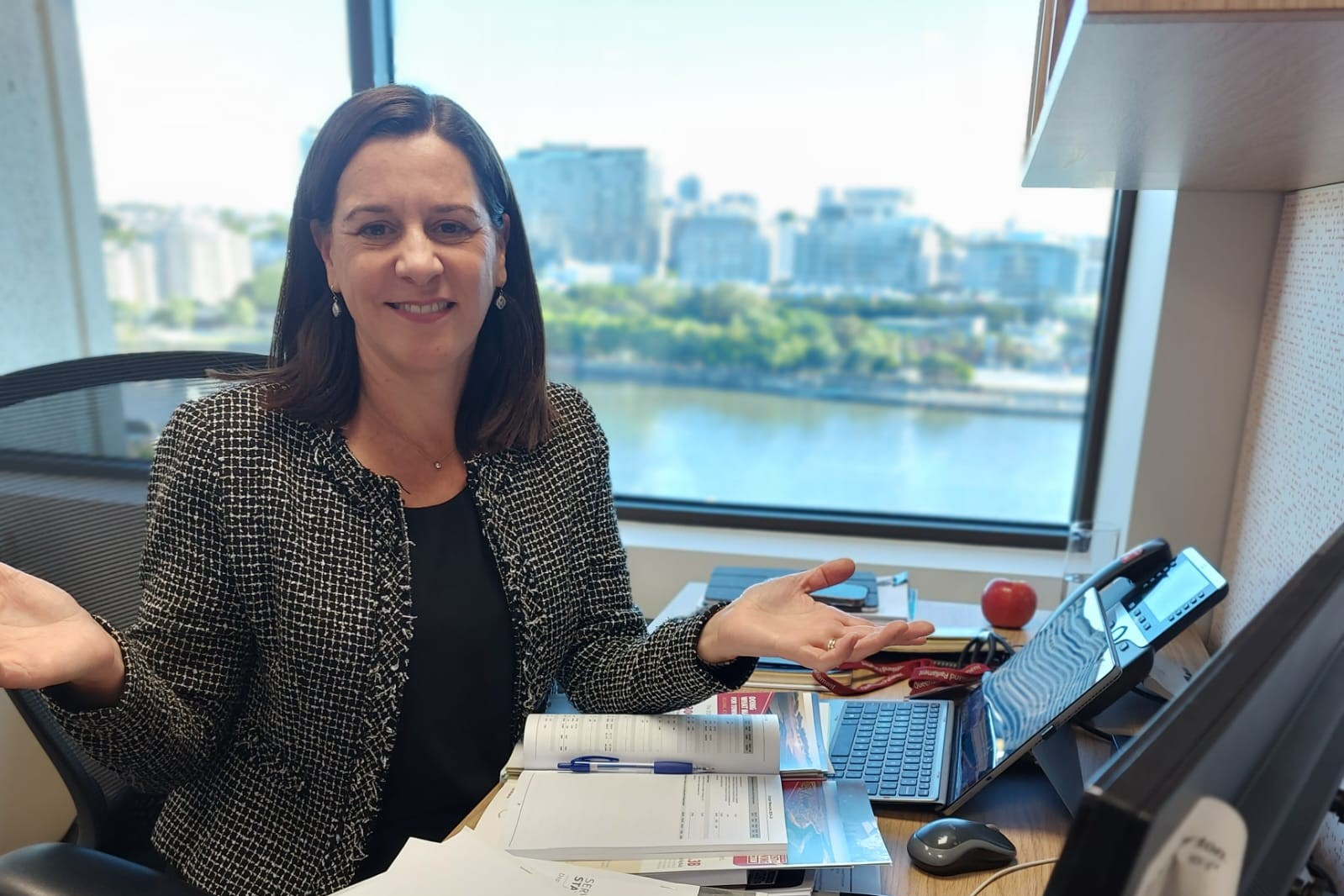 Deb Frecklington MP at her desk with the State Budget papers.