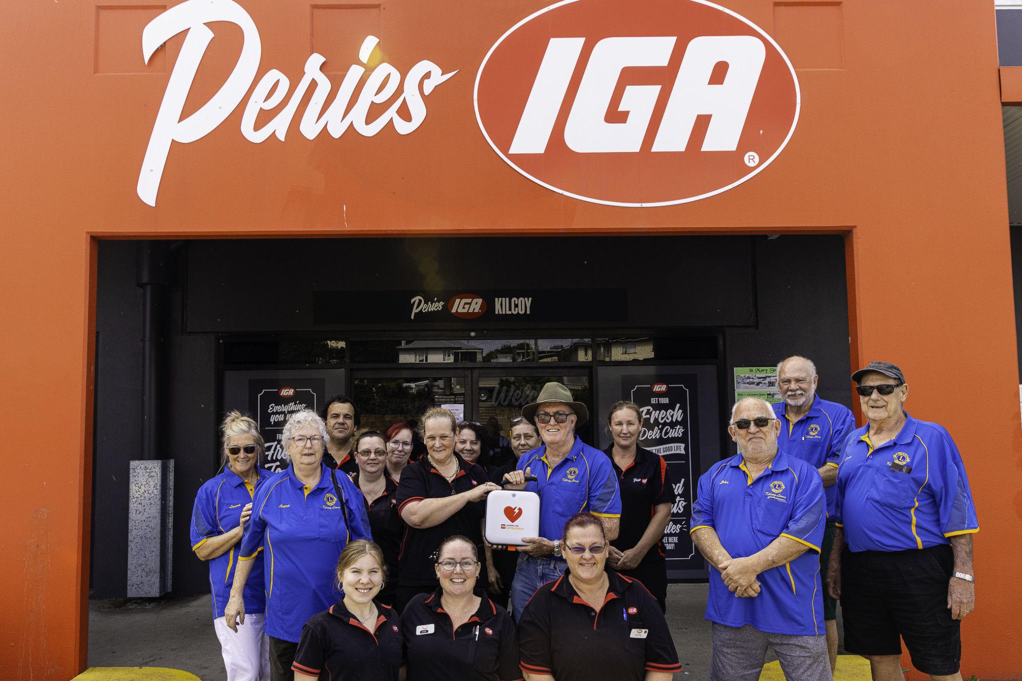 Kilcoy Lions handing over the defibrillator to Kilcoy IGA.