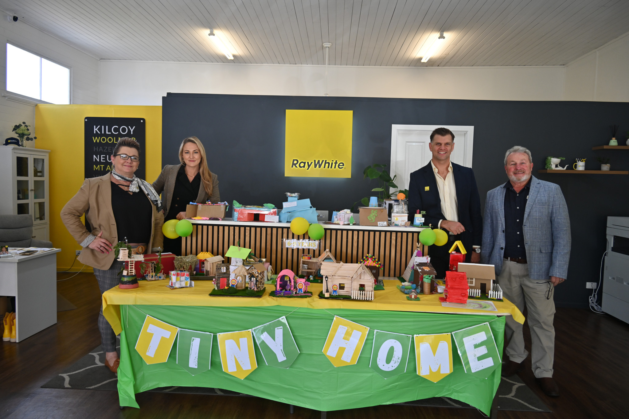Matt White with the Ray White Kilcoy team and tiny homes in 2024.