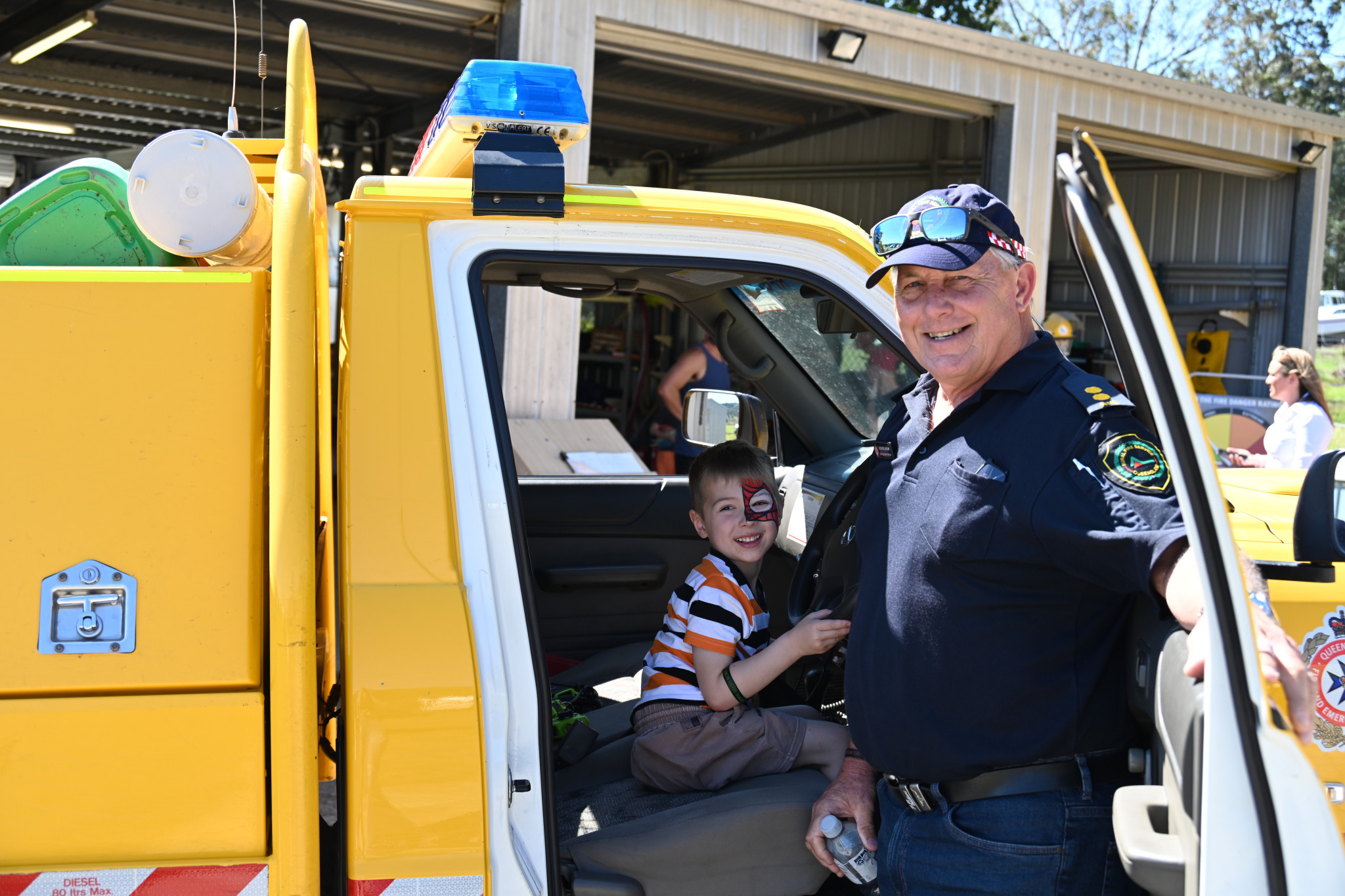 Glen Rollinson and child at Villenueve Fire Brigade open day 2024.