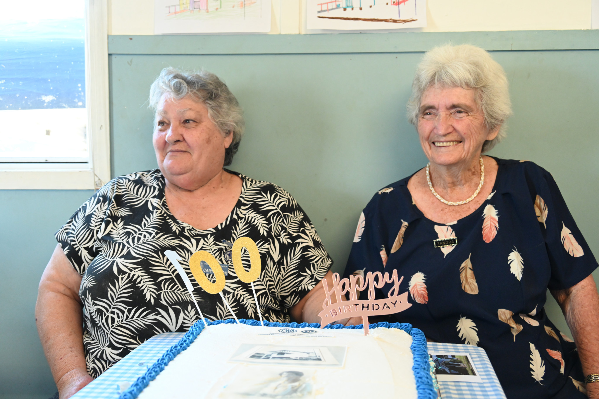 QCWA president Caryl with 100th cake.