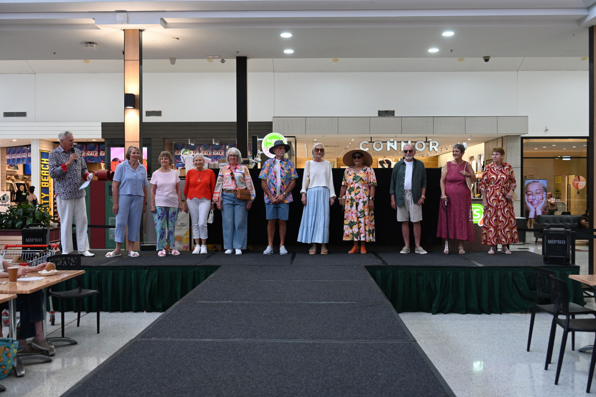 Over 55 models Judy Moller, Heather Toye, Ernie, Pauline, Karey, Graeme, Glenda, Vicki, Gloria and Karen with MC Don. Photos: Marina Gomide.
