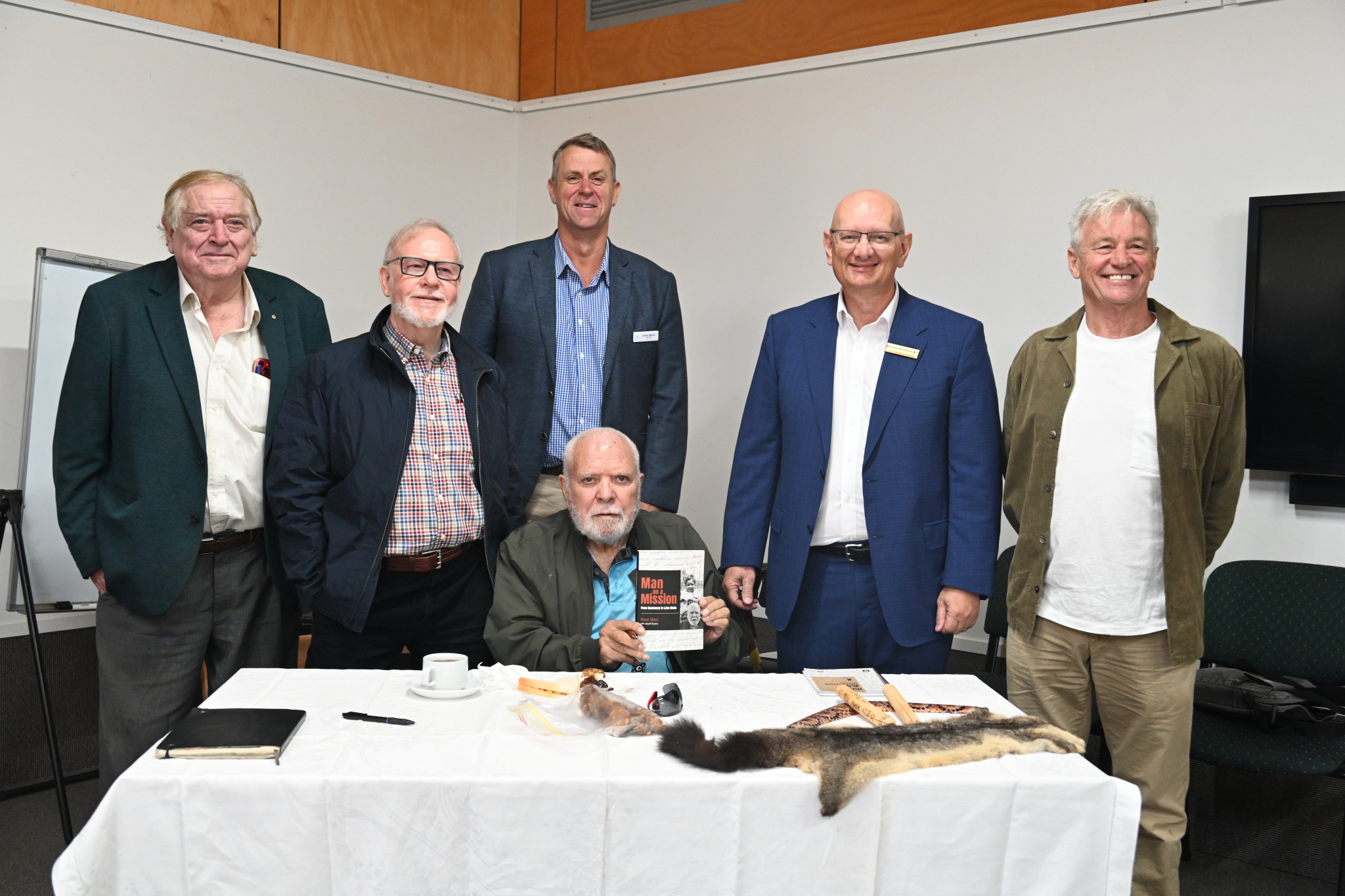 Uncle Noel (sitting) with speakers Bill Hauritz, Dr Tom Doolan, Mayor Jason Wendt, Shayne Neumann MP and co-author Geoff Evans.