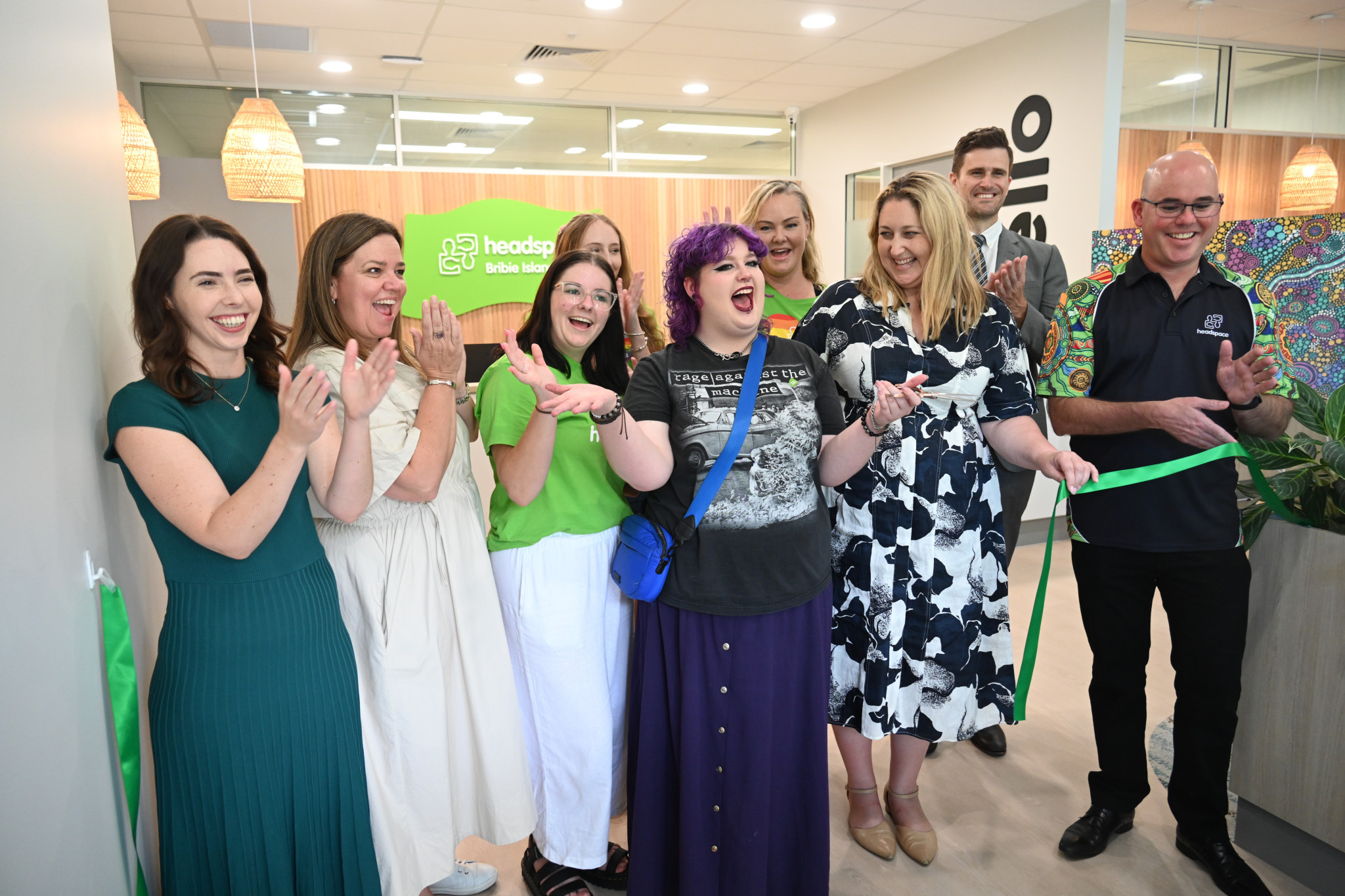 Ribbon cutting at Headspace Bribie Island opening with Felix in the middle and Emma McBride MP on her right.