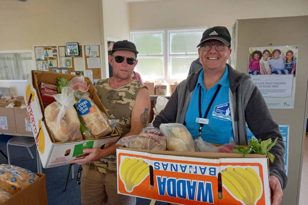 Volunteers from Moreton Bay Community Matters providing families with fresh food hampers.