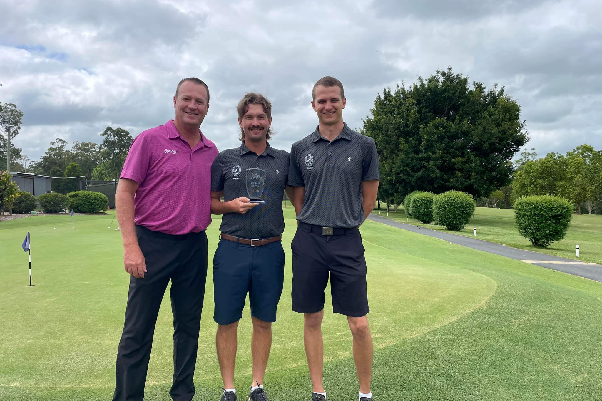Golf participation manager Scott Simons presents the My Golf Centre Term 3 award to Michael Brodie and Dean Dagan of Woodford Golf Club.
