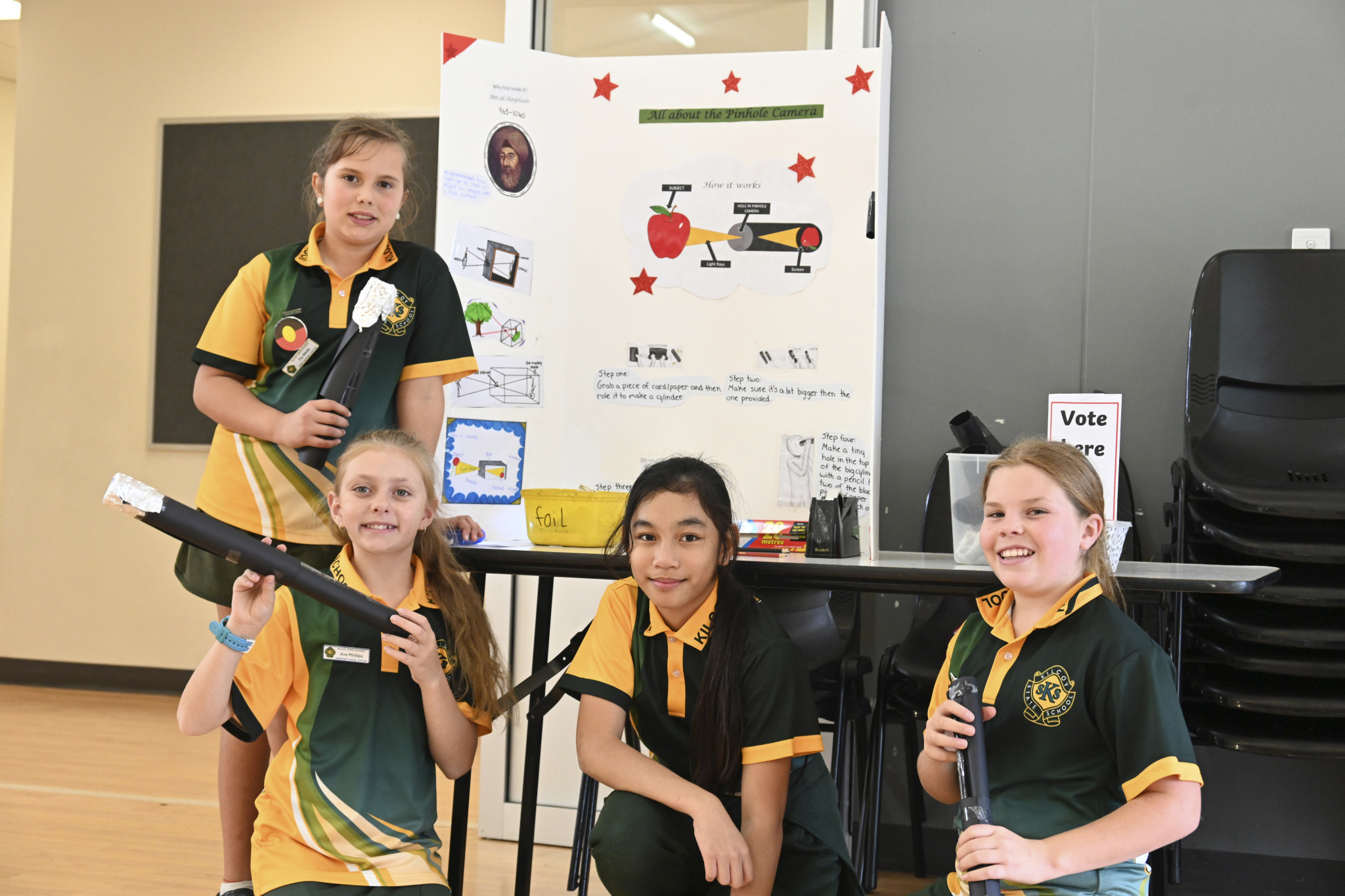 Year 6 students Ava, Tia, Riezil and Faith with their pinhole camera project.