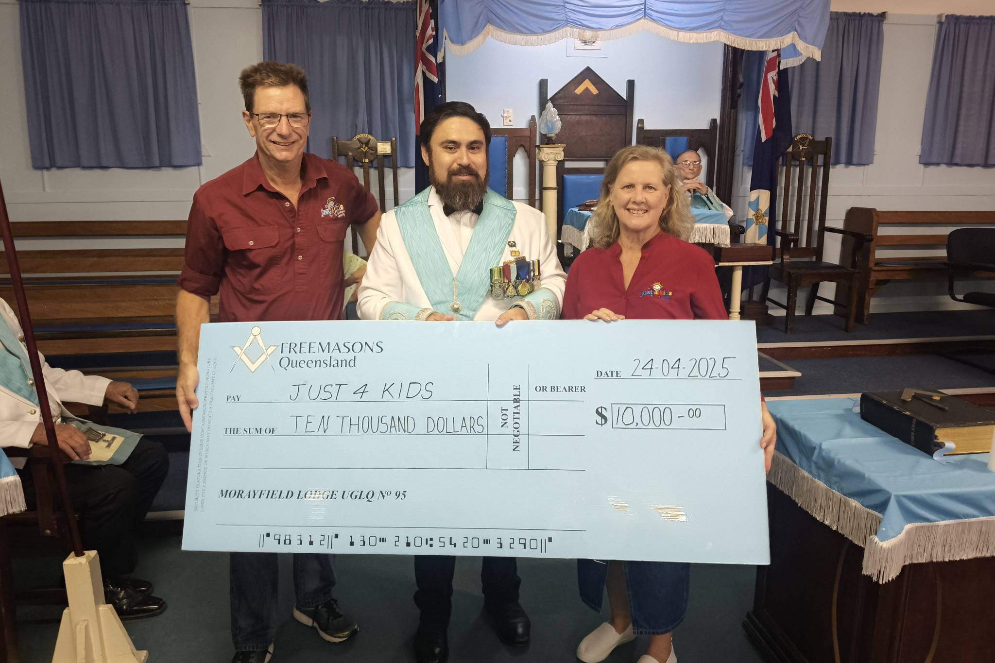 Worshipful Master Nathan Loughnan presenting cheque to Just 4 Kids president, Tony Gardiner, and secretary, Joanne Gardiner
