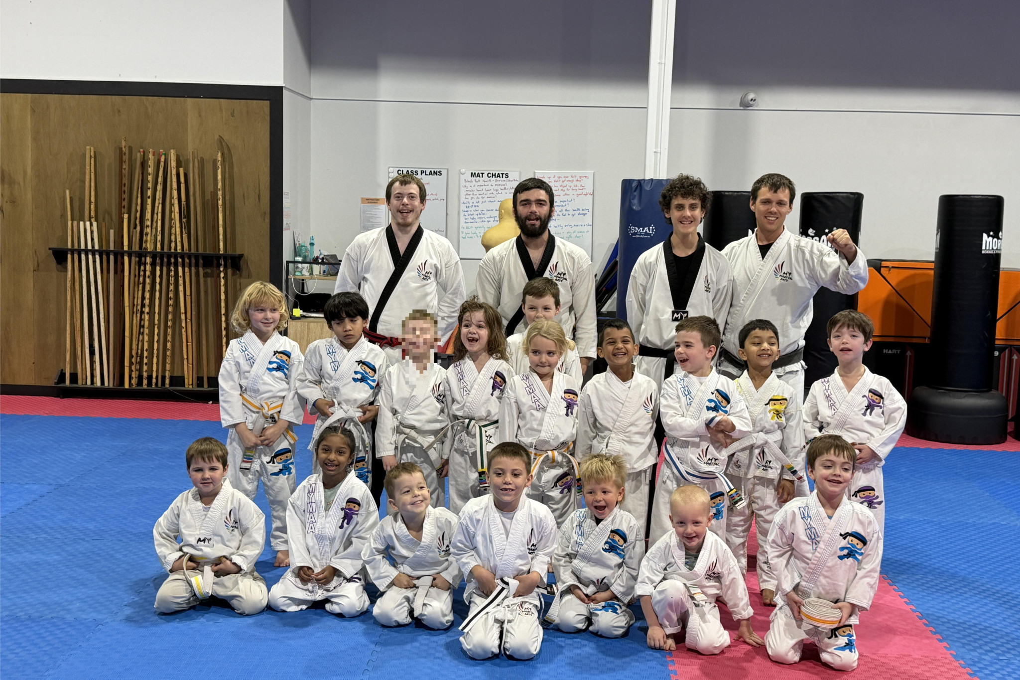 Tiny titans earn their first ever black belts - feature photo