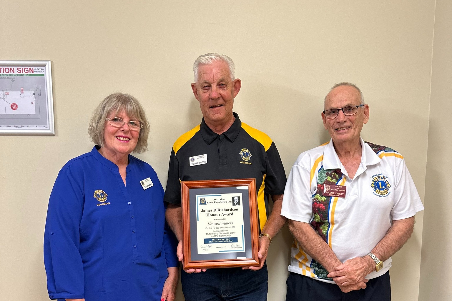 Award-winning Lions Club of Wamuran member Howard Walters (middle) with club president Sue Clement and district governor Graeme Emery.