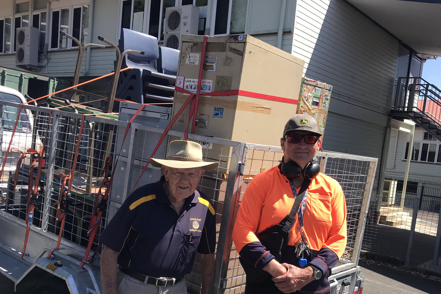 School’s Off icer, Andrew Elton, and Caboolture Rotarian Leon Misfeld check furniture destined for a Pacifi c Island nation. Photo supplied.
