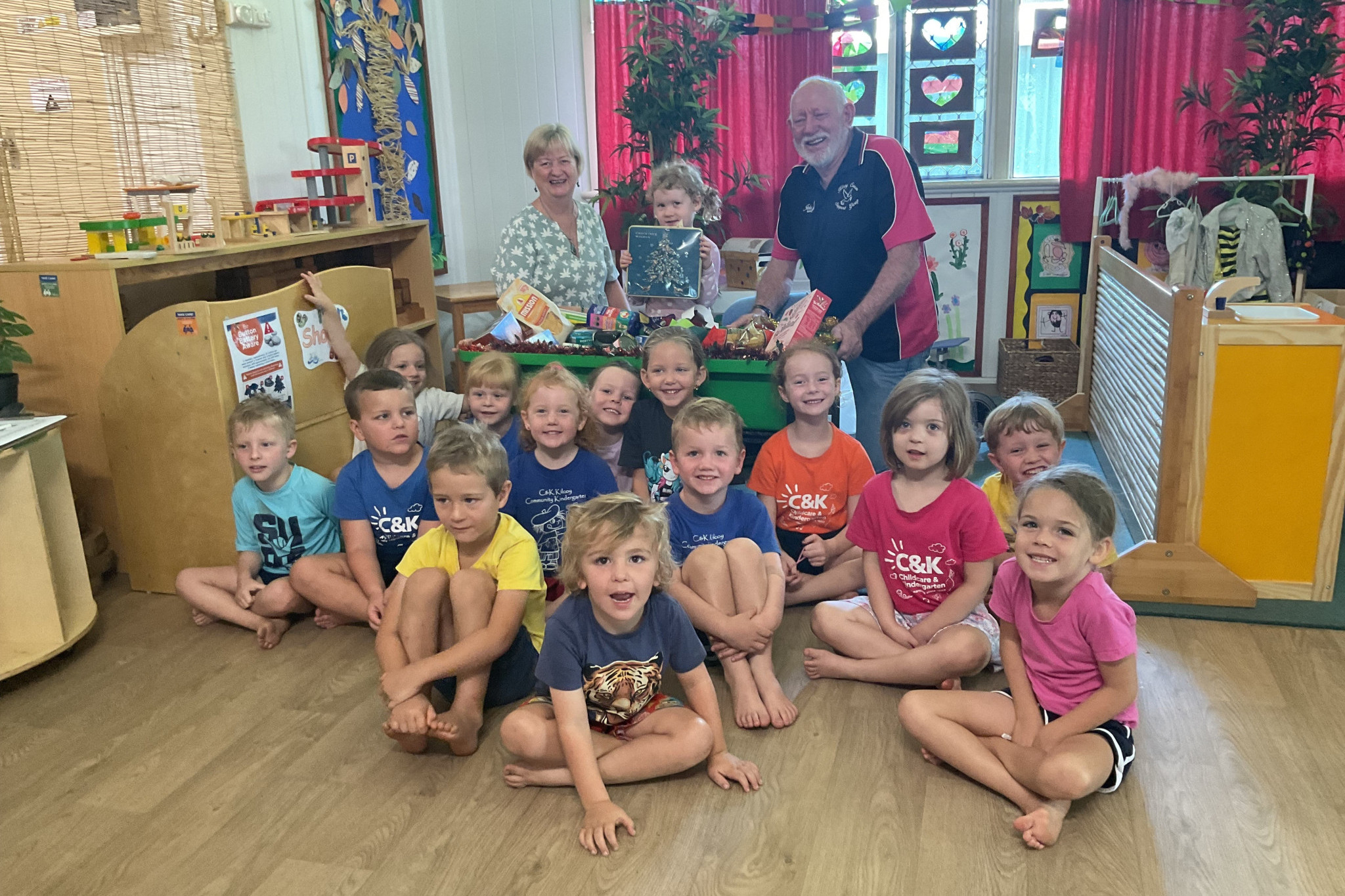 John Robinson from the Kilcoy Cancer Support Group ‘Breast and the Rest’, pictured with children from C&K Kilcoy Community Kindergarten as the kindergarten supported this charity.
