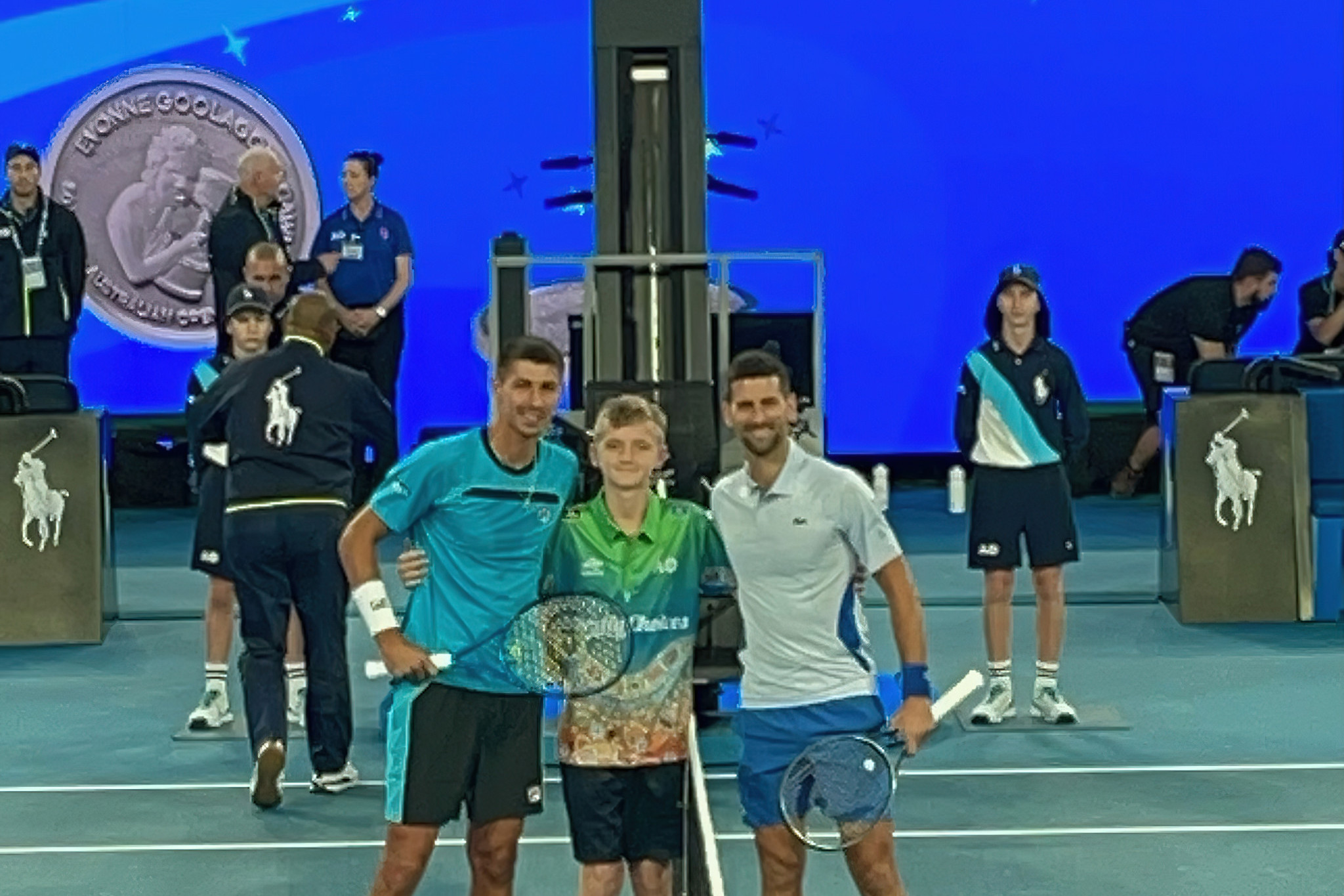 Koby Adams (centre) with Alexei Popyrin and Novak Djokovic.